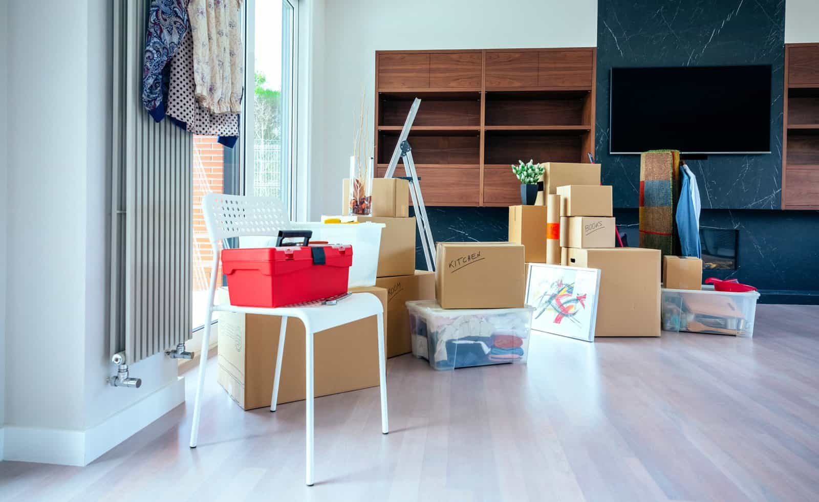 Moving boxes stacked inside a modern home ready for move-in or move-out cleaning